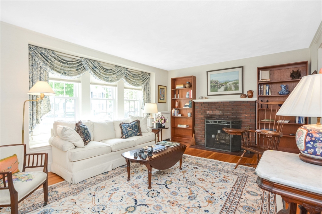 21 Stevens Road Needham, MA 02492 - Photo 8 of 26 a living room with furniture and a fireplace