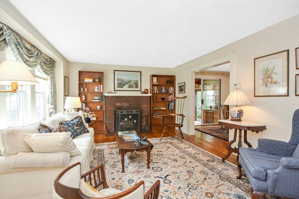 21 Stevens Road Needham, MA 02492 - Photo 9 of 26 a living room with furniture and a fireplace