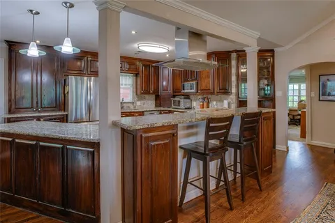 a kitchen with a table and chairs in it