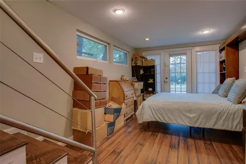 a bed room with two beds and a large window