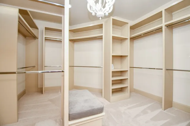 a view of closet area with empty racks