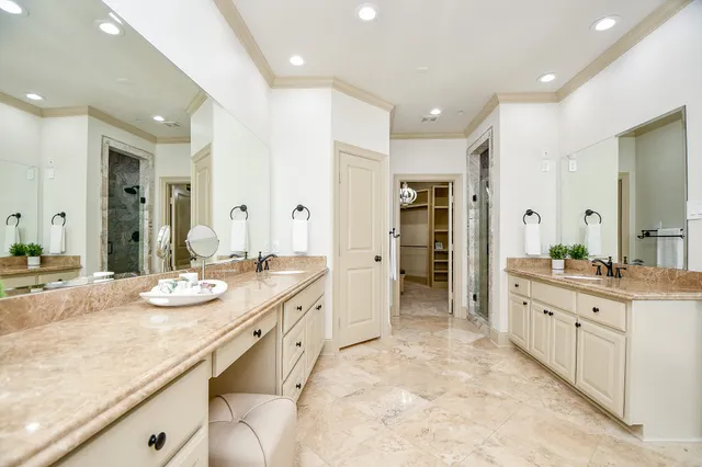 a large bathroom with a granite countertop sink and a large mirror