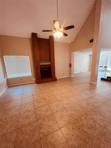 a view of a livingroom with a furniture and chandelier fan