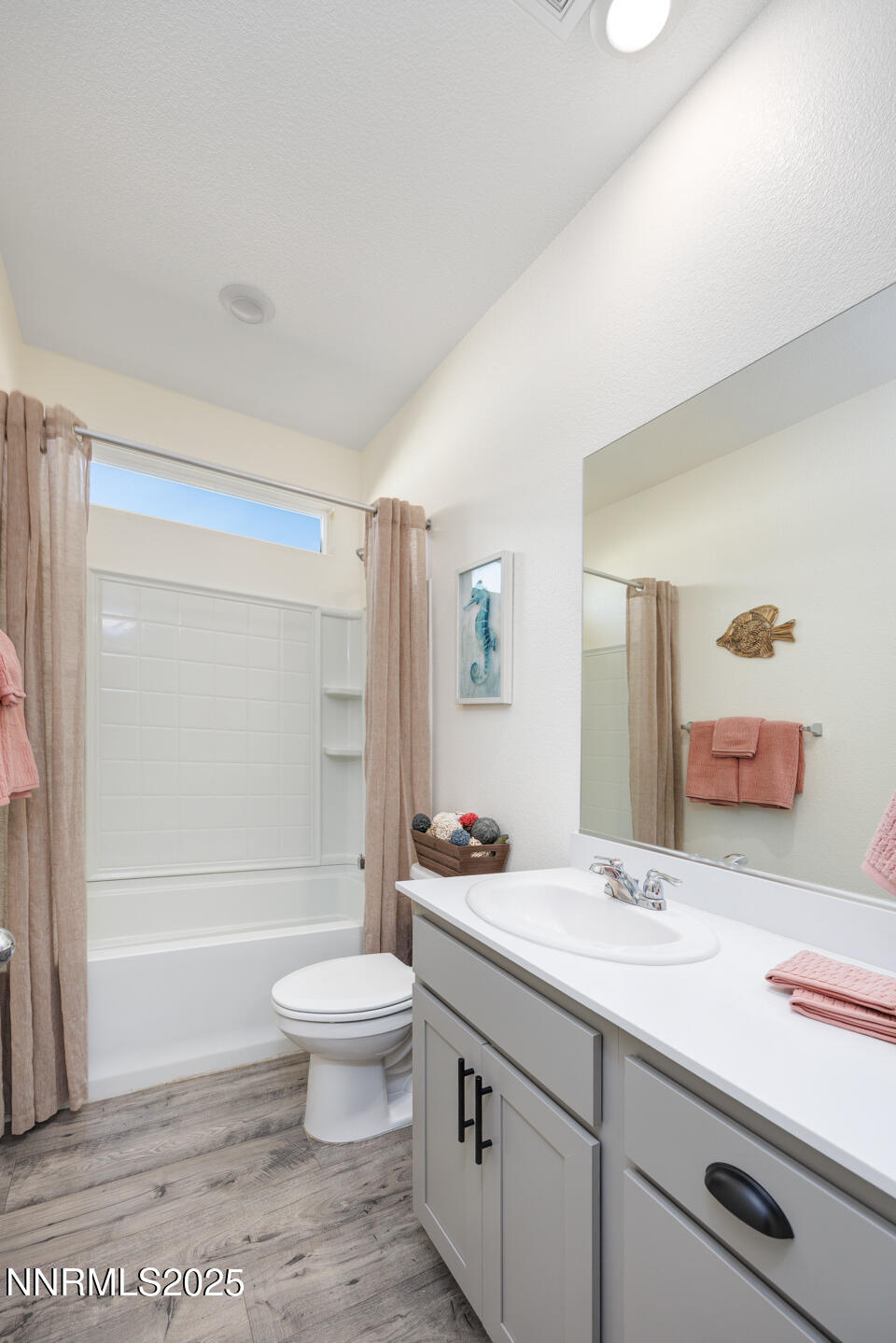 775 Karry Way Fallon, NV 89406 - Photo 11 of 26 a bathroom with a sink a toilet and a large mirror