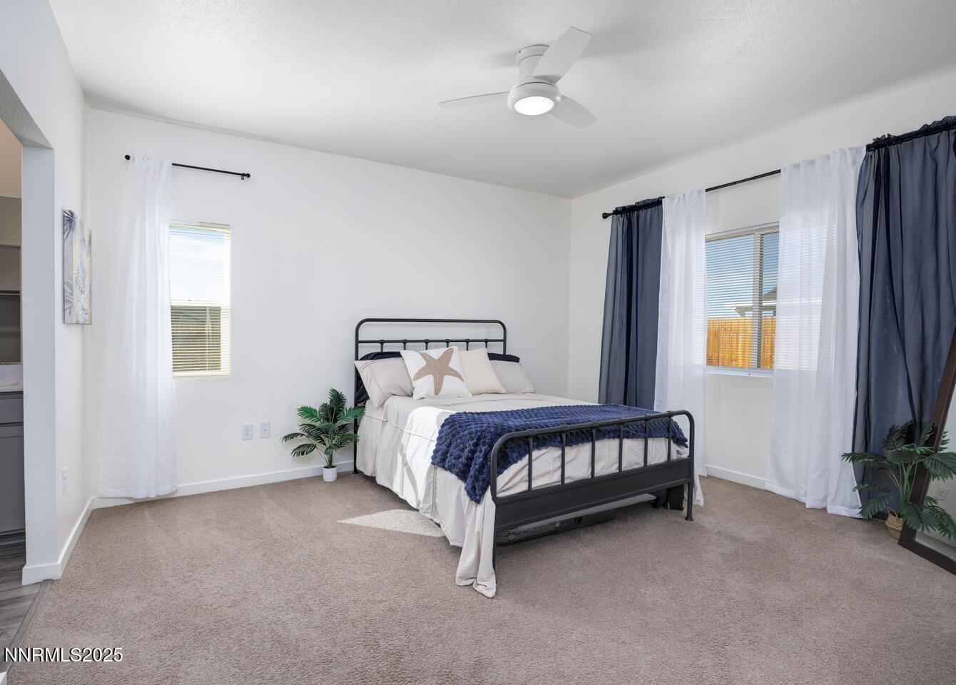775 Karry Way Fallon, NV 89406 - Photo 14 of 26 a bed sitting in a spacious bedroom next to a window and a larger closet