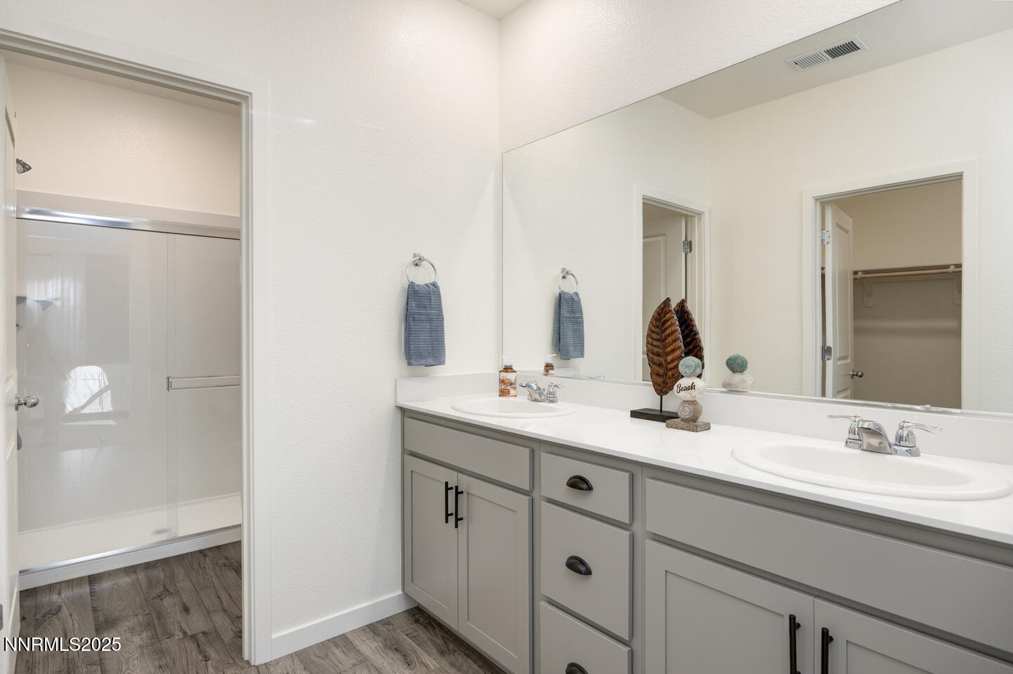 775 Karry Way Fallon, NV 89406 - Photo 15 of 26 a bathroom with a double vanity sink and mirror