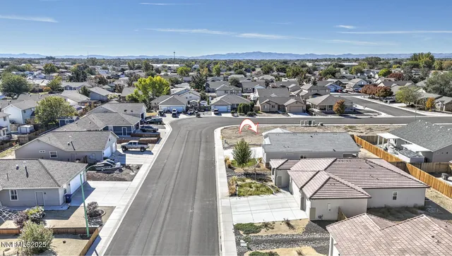 an aerial view of a house with a ocean view