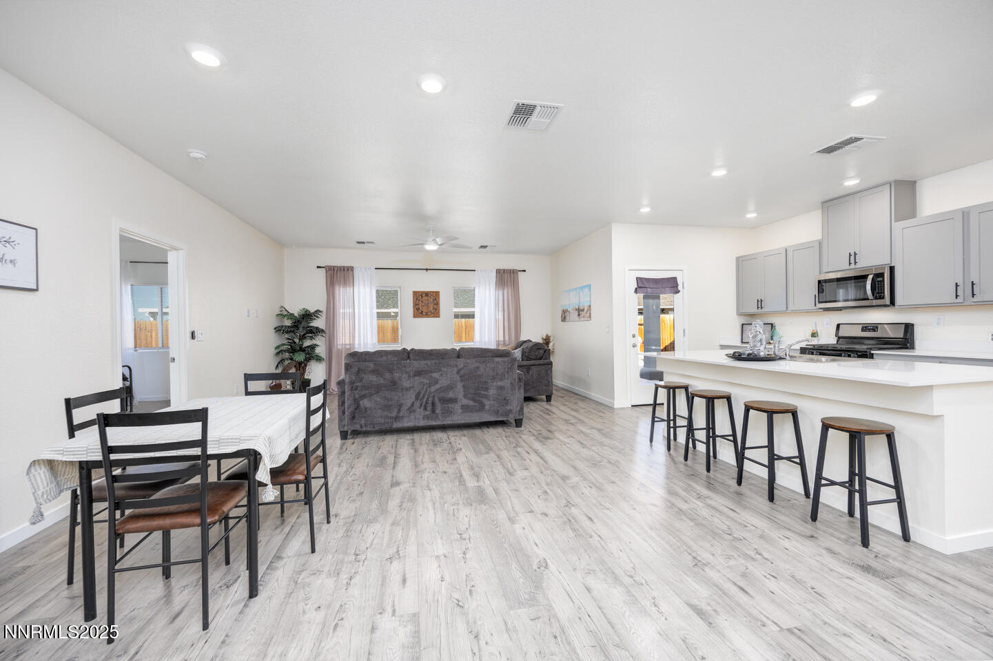 775 Karry Way Fallon, NV 89406 - Photo 4 of 26 a living room with furniture and a wooden floor