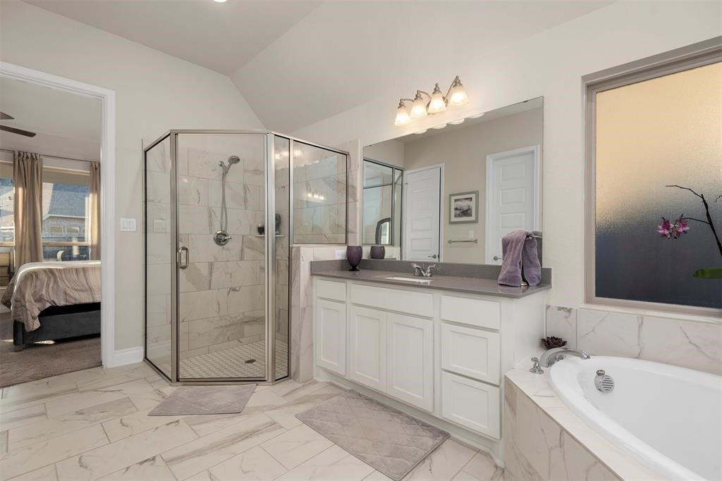 28196 Knight Peak Drive Spring, TX 77386 - Photo 14 of 31 a spacious bathroom with a tub shower and sink