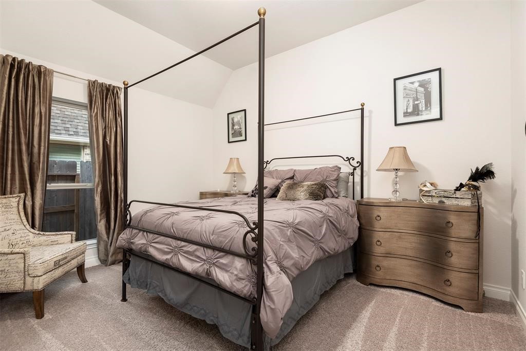 28196 Knight Peak Drive Spring, TX 77386 - Photo 18 of 31 a bedroom with a bed lamp and a window