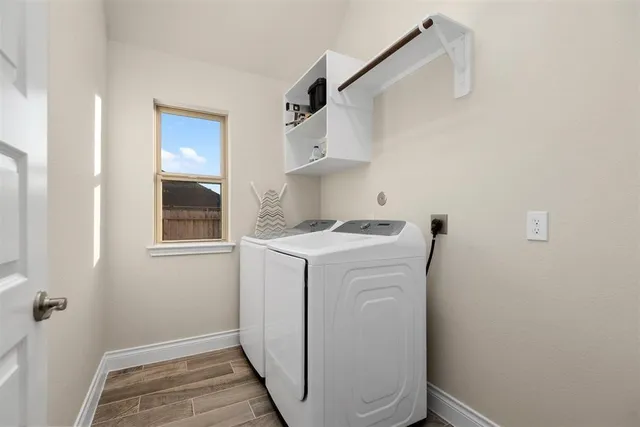a utility room with dryer and washer