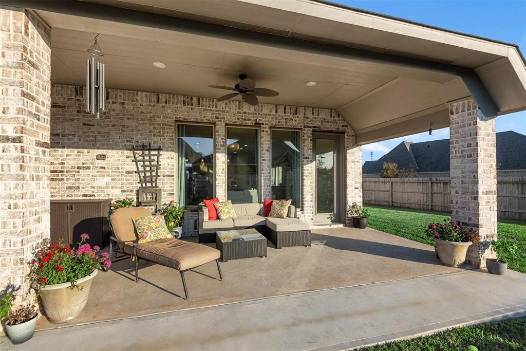 28196 Knight Peak Drive Spring, TX 77386 - Photo 24 of 31 a building outdoor space with patio furniture and potted plants