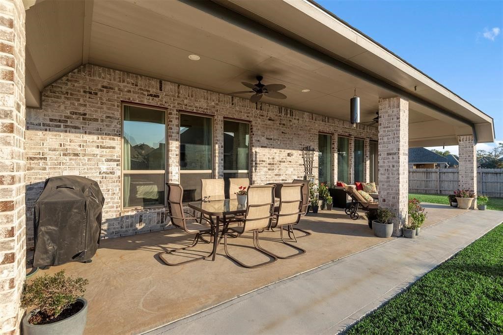 28196 Knight Peak Drive Spring, TX 77386 - Photo 25 of 31 a view of a patio with table and chairs and potted plants