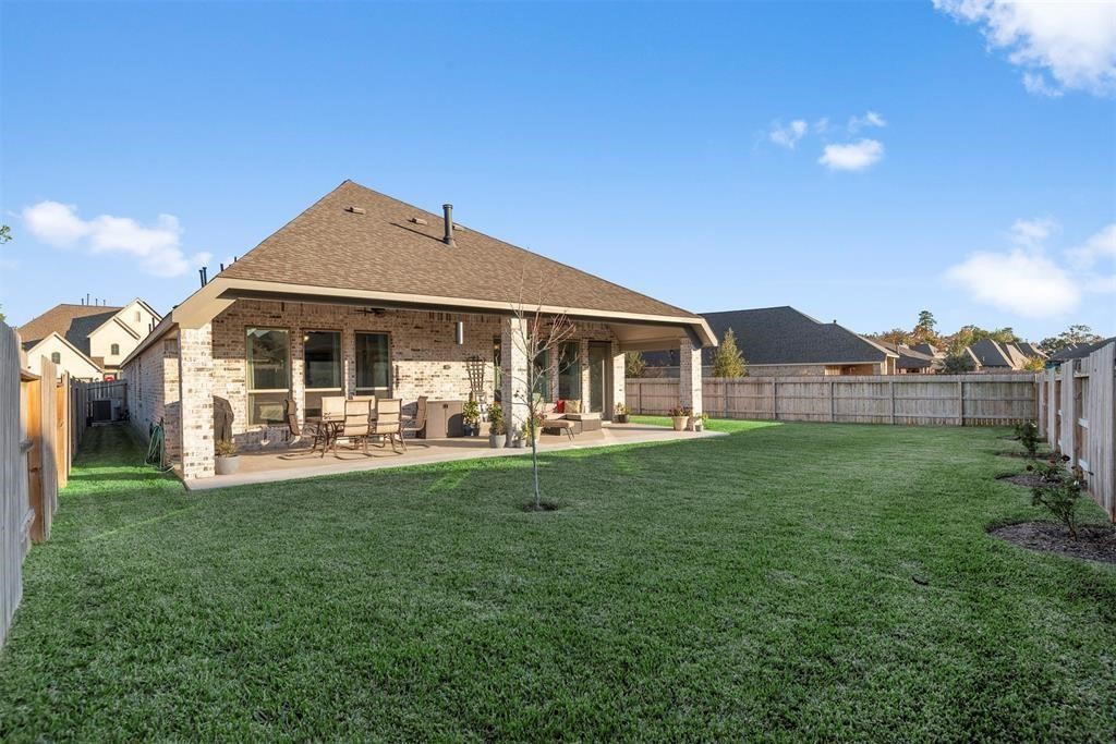 28196 Knight Peak Drive Spring, TX 77386 - Photo 27 of 31 a front view of a house with a yard