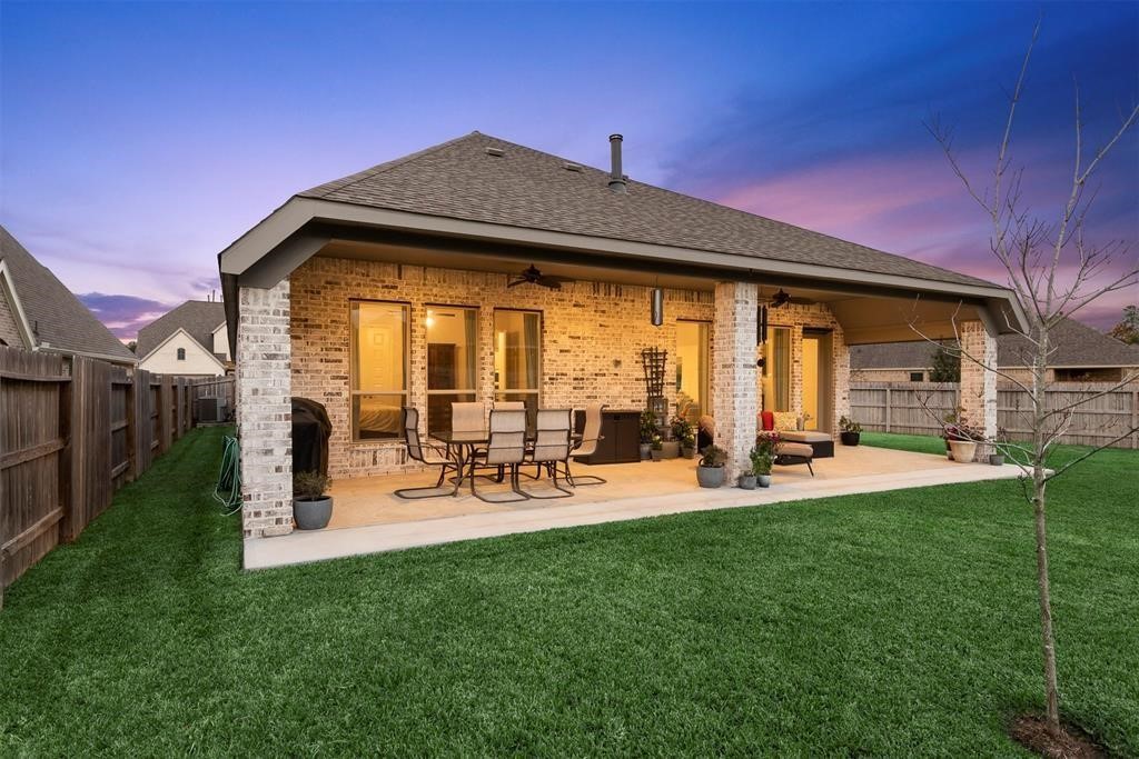 28196 Knight Peak Drive Spring, TX 77386 - Photo 29 of 31 a view of a backyard with sitting area and slide
