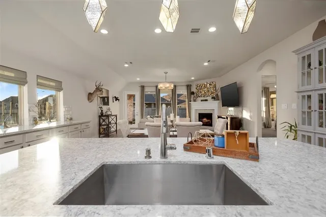 a view of a living room and kitchen