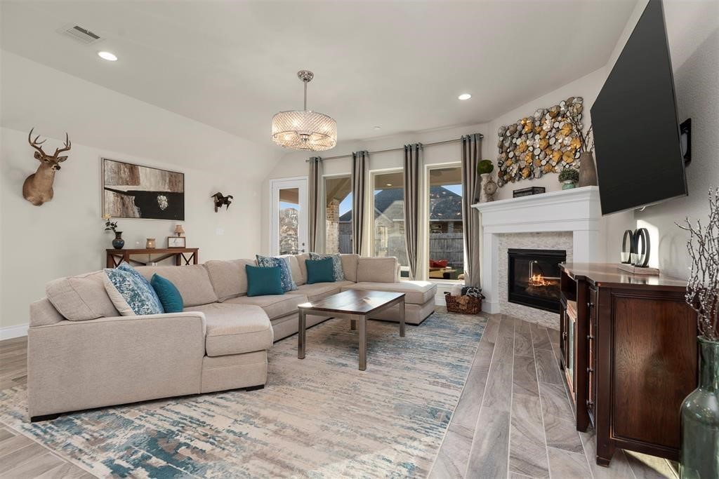 28196 Knight Peak Drive Spring, TX 77386 - Photo 9 of 31 a living room with furniture and a fireplace