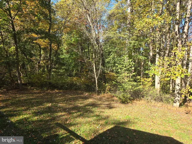 a view of balcony with wooden floor