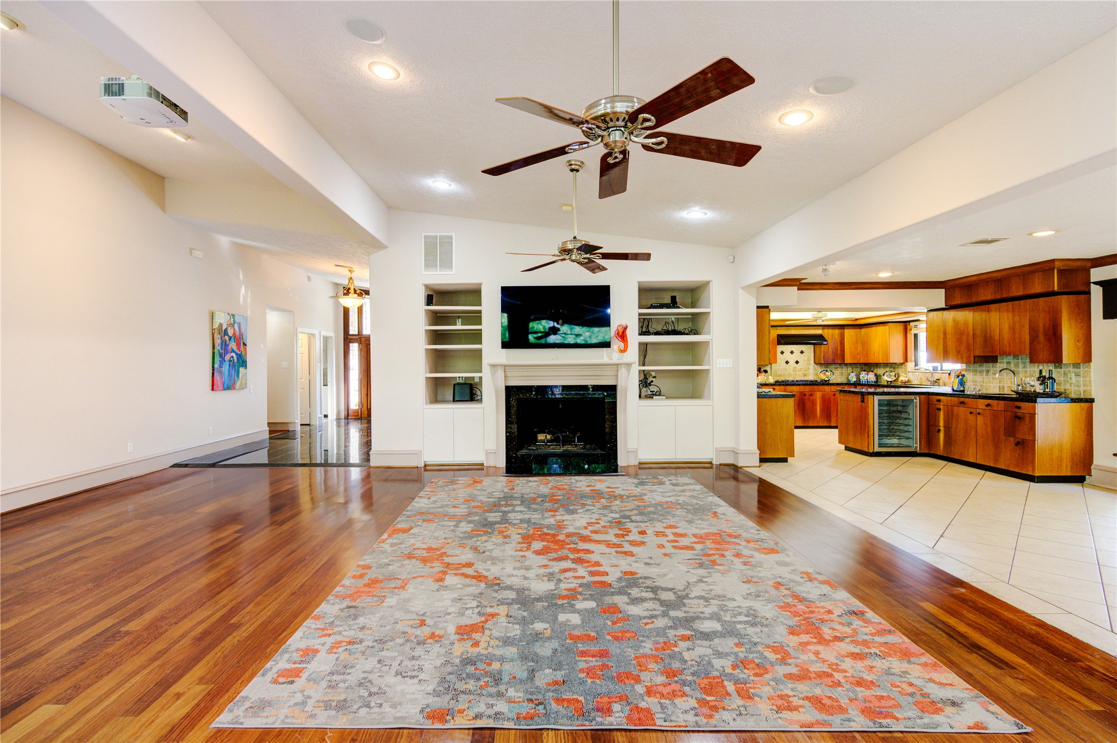 6 Gessner Road Houston, TX 77024 - Photo 12 of 49 Black marble surround accents the gas fireplace. Lots of added built in storage.