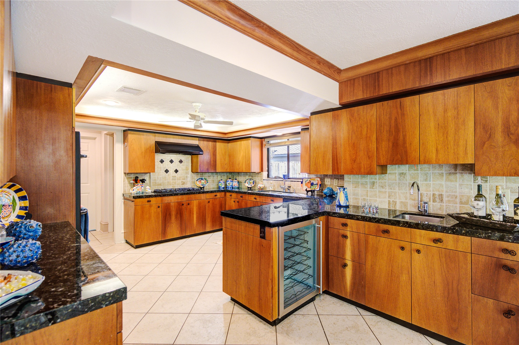 6 Gessner Road Houston, TX 77024 - Photo 17 of 49 a kitchen with stainless steel appliances granite countertop a sink and cabinets