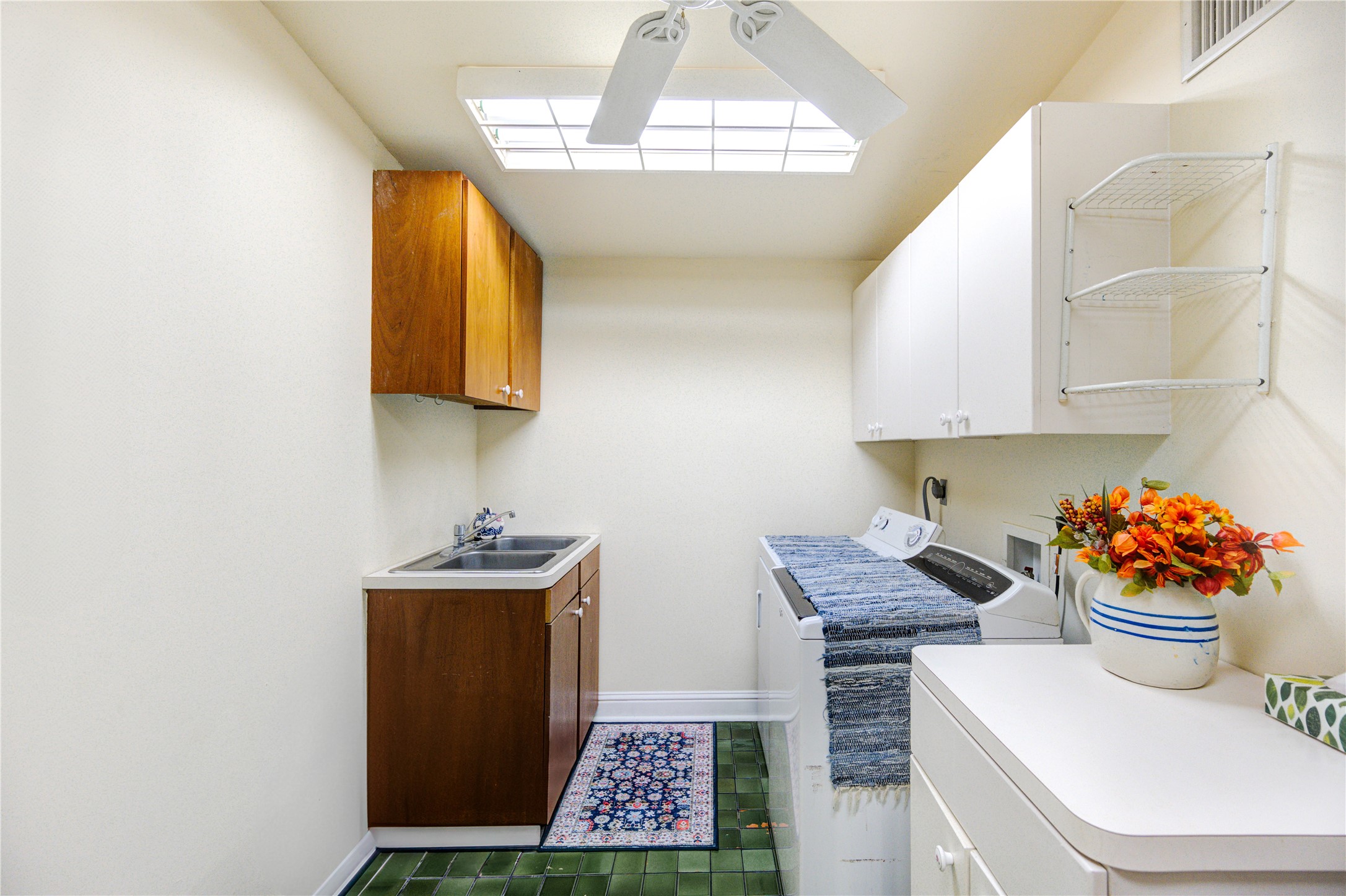 6 Gessner Road Houston, TX 77024 - Photo 20 of 49 Generous laundry room with sink and built in pantry storage.