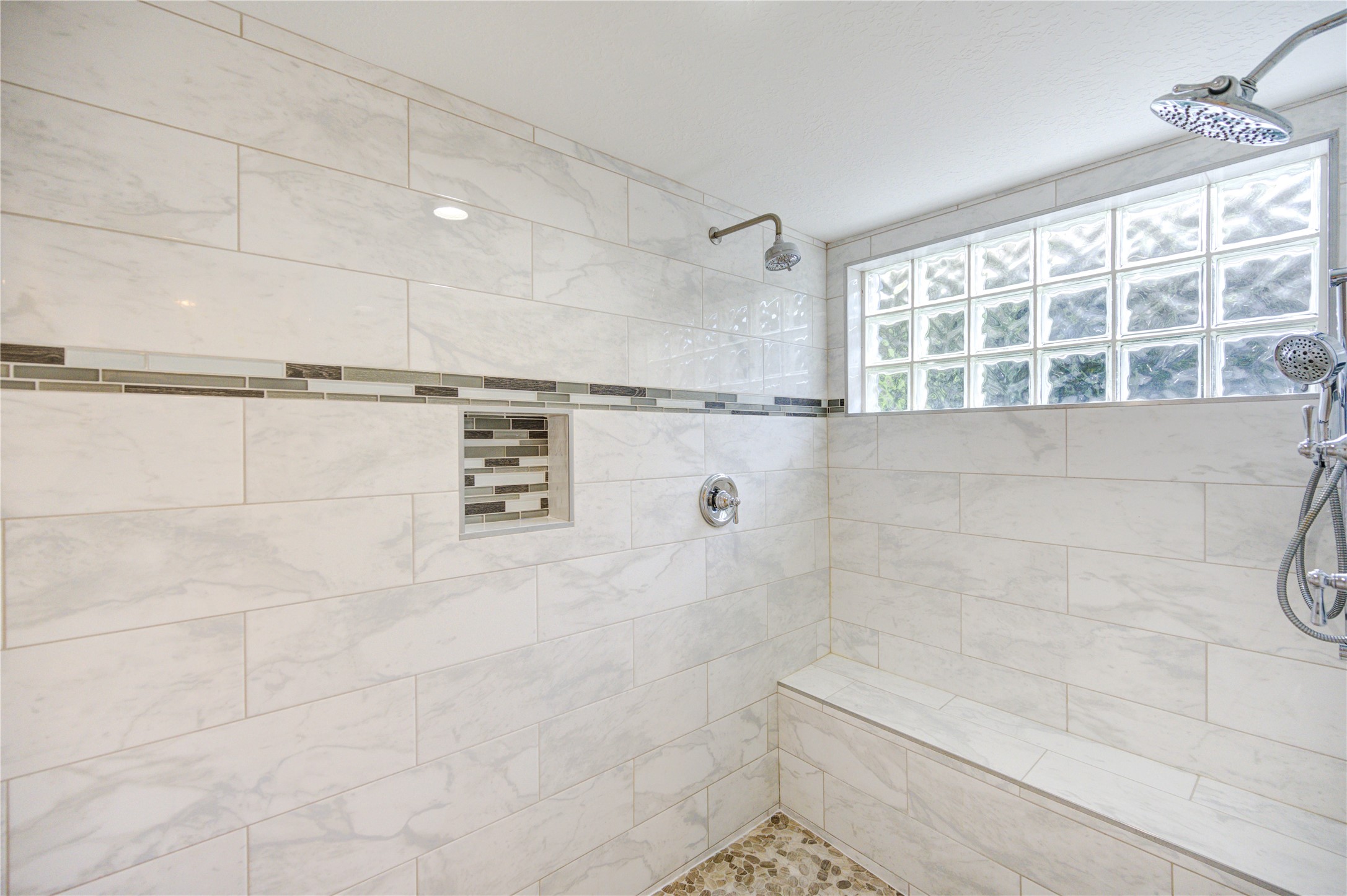 6 Gessner Road Houston, TX 77024 - Photo 28 of 49 Large format tile was used when updating the shower and 2 shower heads.