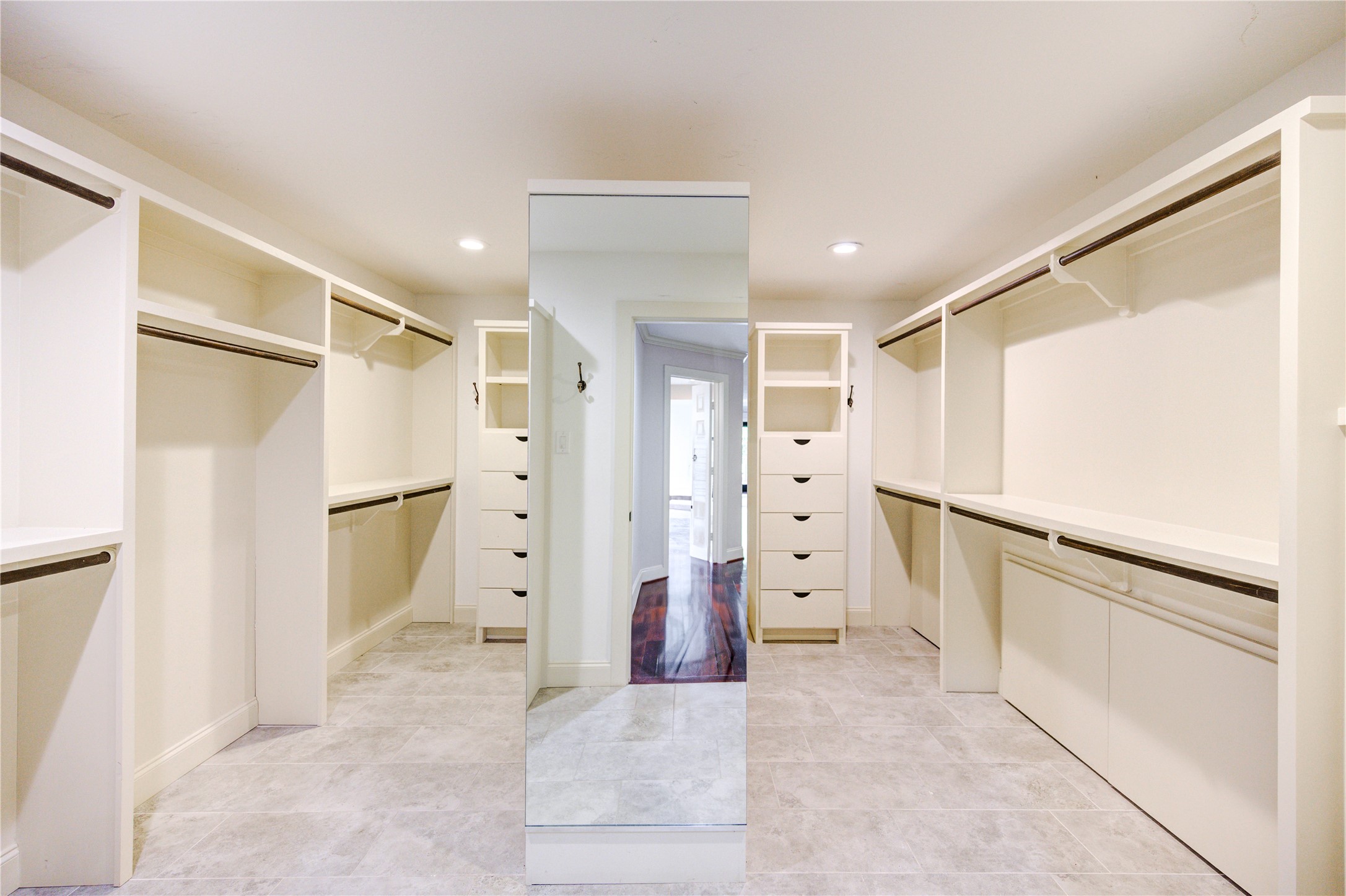 6 Gessner Road Houston, TX 77024 - Photo 30 of 49 Custom built closets with abundance of storage. Extra storage under the bottom bars for suitcases.