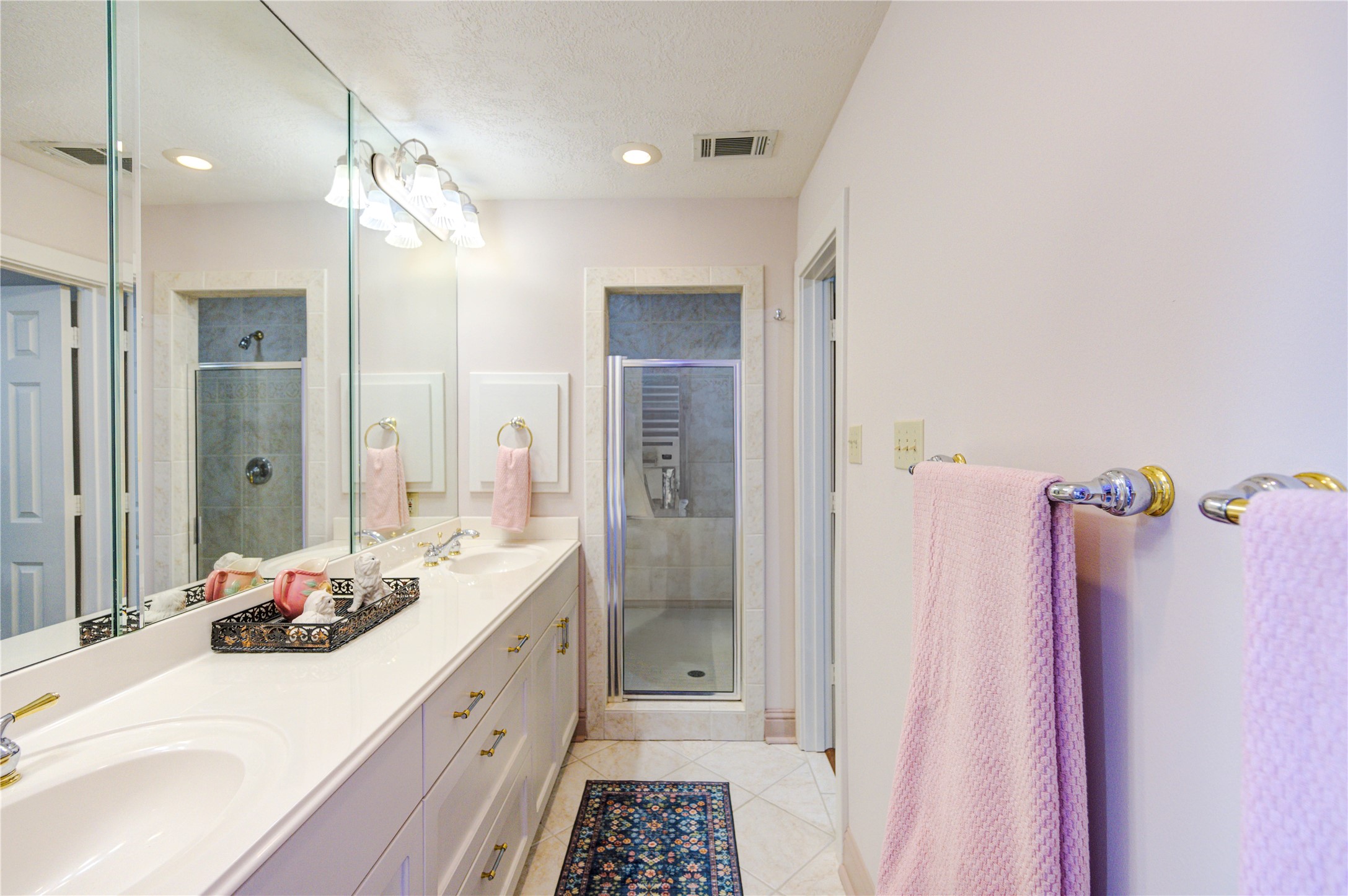 6 Gessner Road Houston, TX 77024 - Photo 34 of 49 a bathroom with a sink vanity granite tub and shower