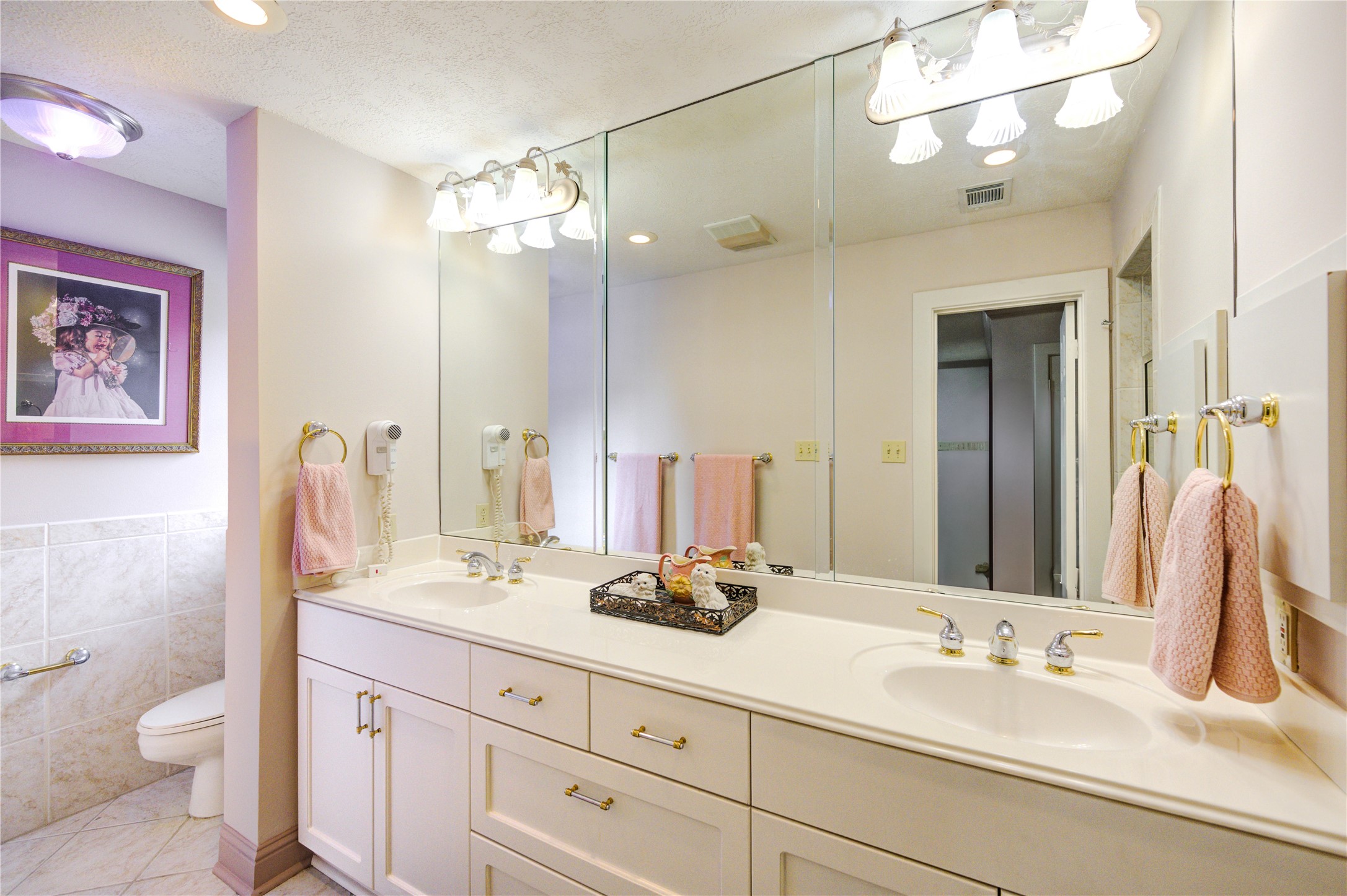 6 Gessner Road Houston, TX 77024 - Photo 35 of 49 Upstairs bath has lots of storage and a large walk in shower.