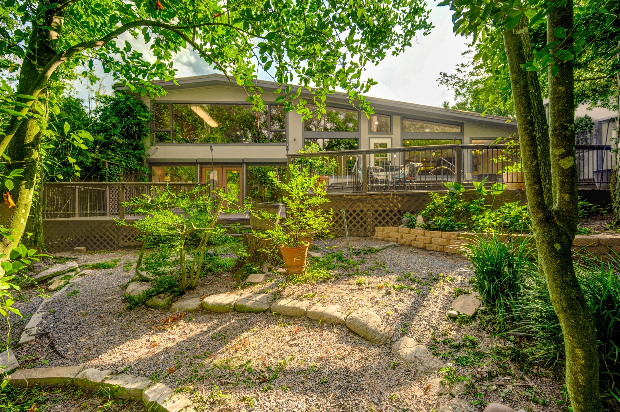 6 Gessner Road Houston, TX 77024 - Photo 42 of 49 Paths on either side of the deck wander to Stoney Creek that joins up with the Bayou.