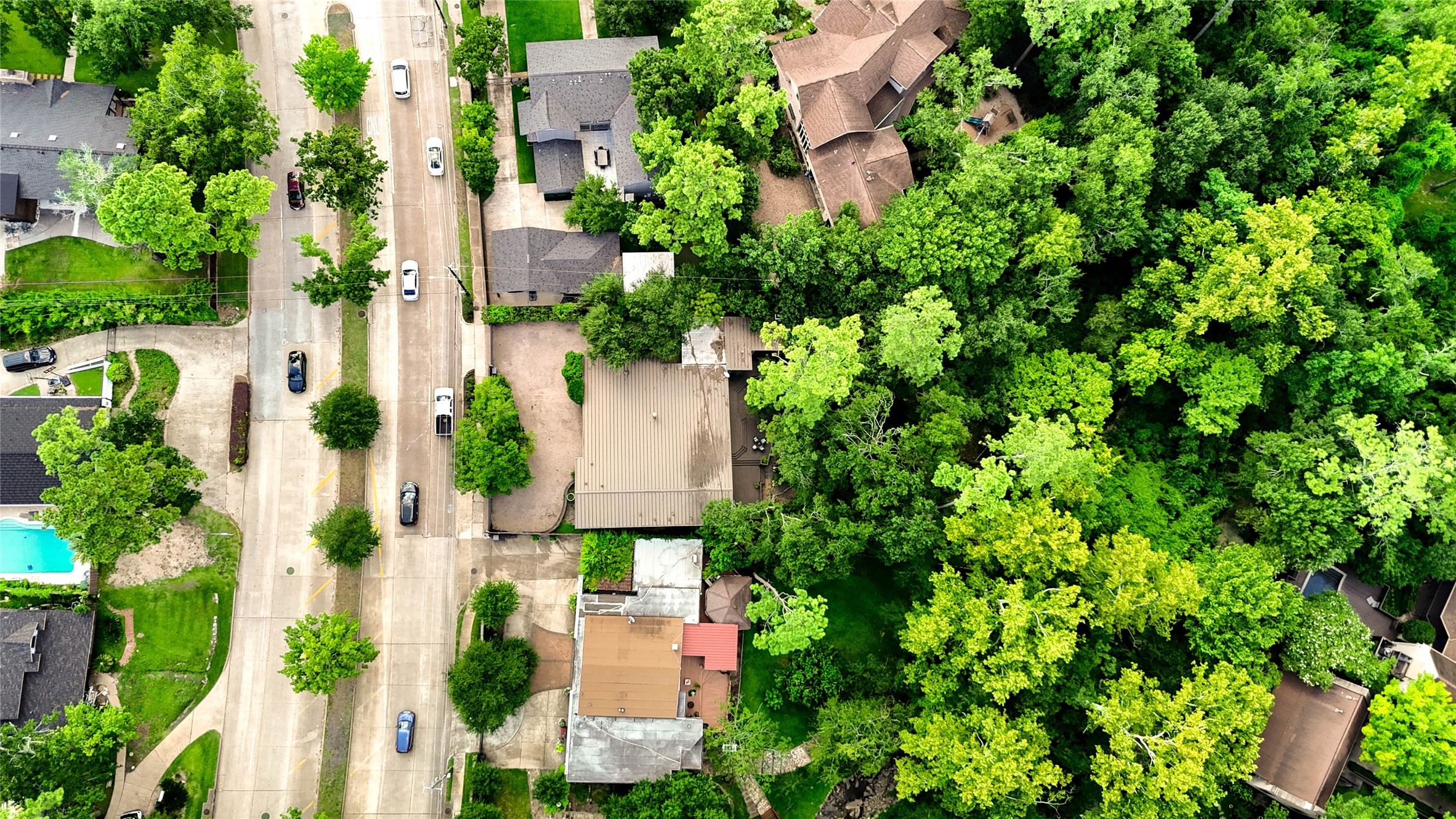 6 Gessner Road Houston, TX 77024 - Photo 47 of 49 an aerial view of a house with a yard and garden