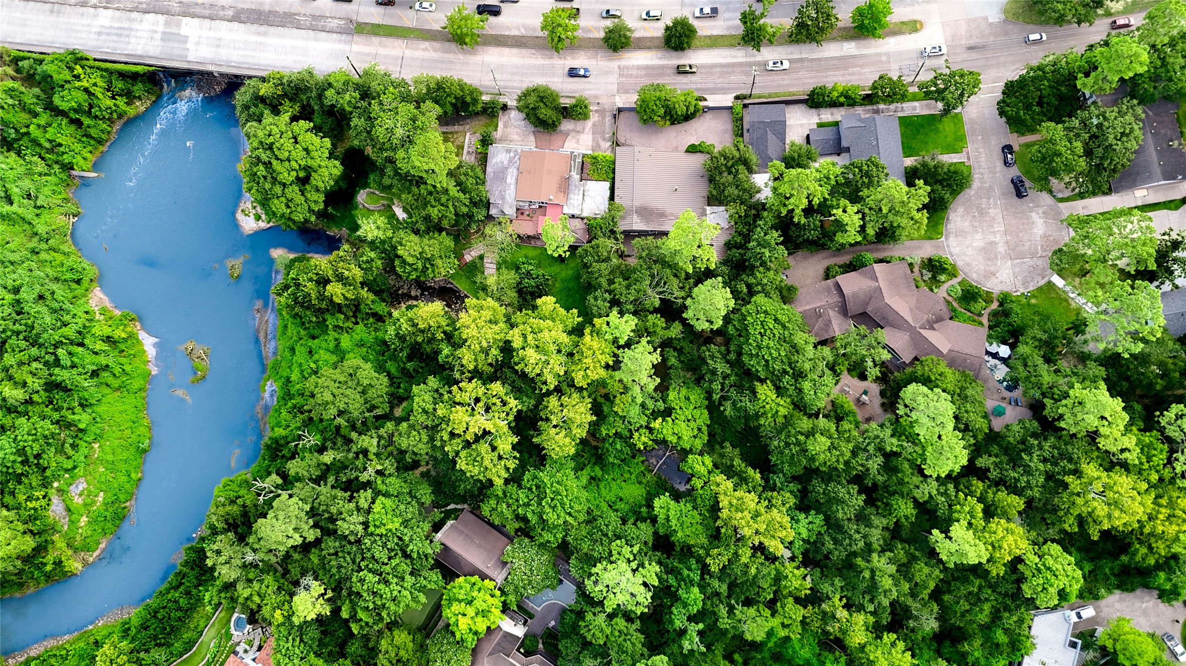 6 Gessner Road Houston, TX 77024 - Photo 48 of 49 an aerial view of a house with a yard and garden