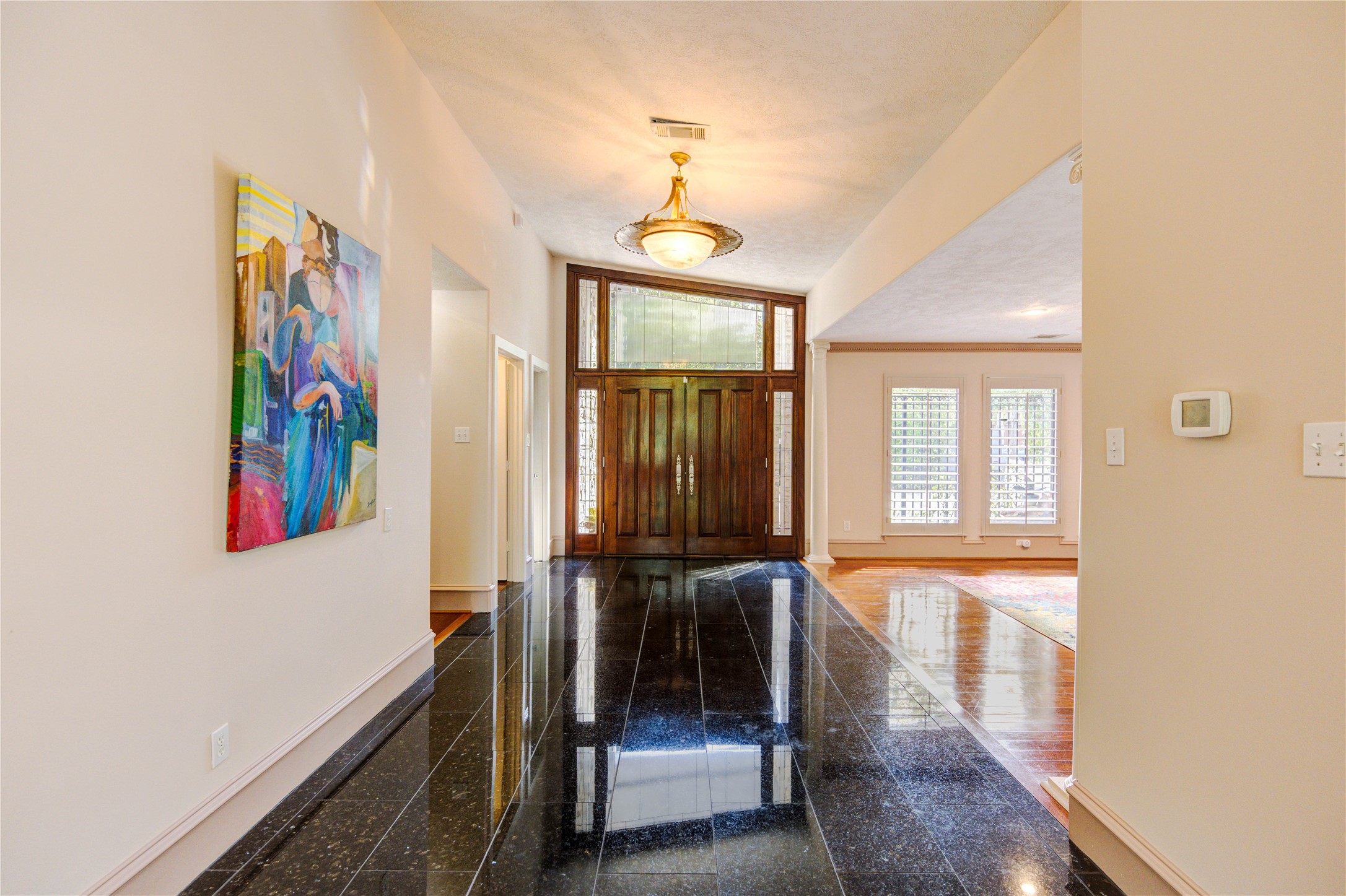 6 Gessner Road Houston, TX 77024 - Photo 7 of 49 a view of a hallway with wooden floor and staircase