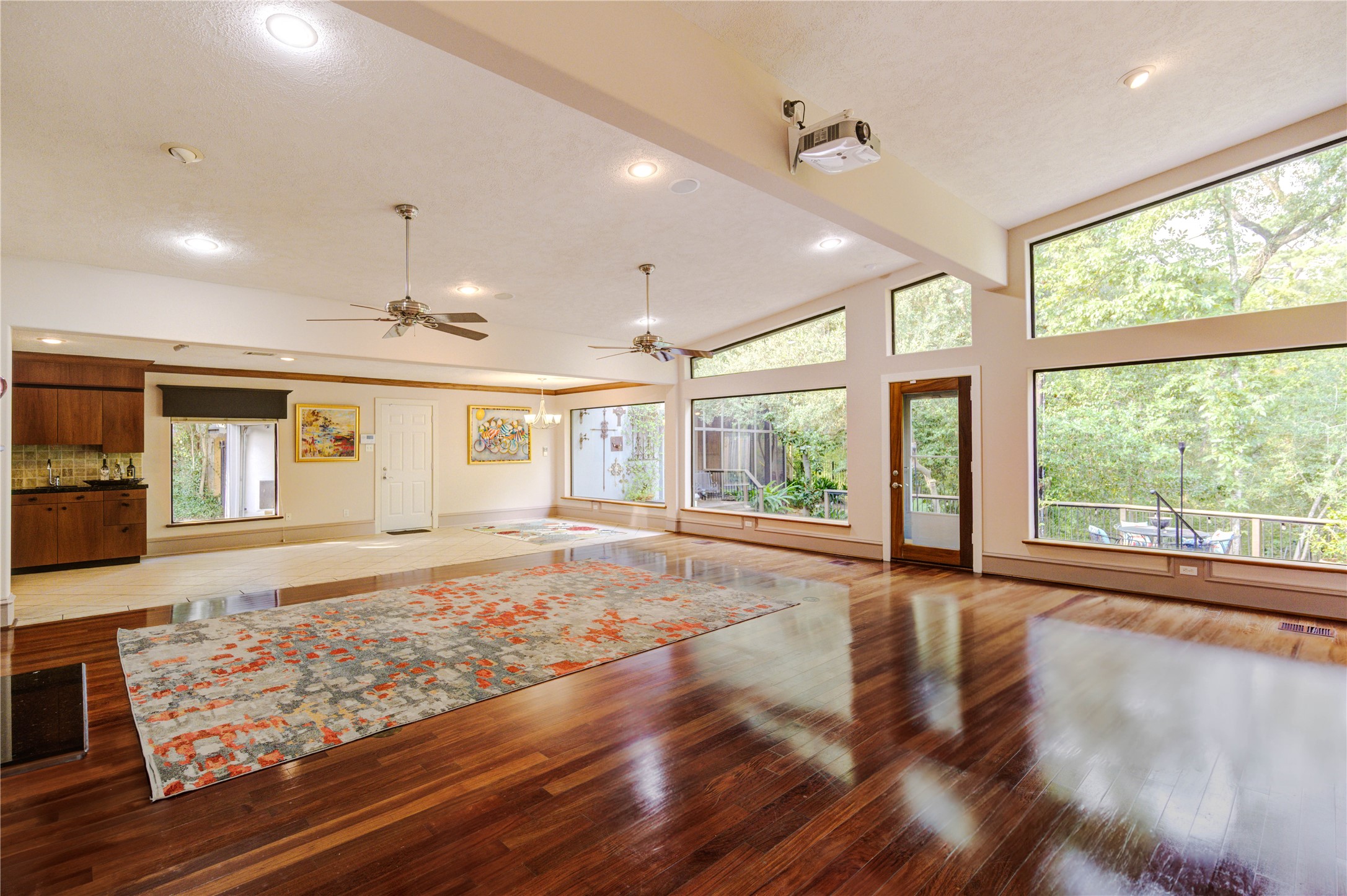 6 Gessner Road Houston, TX 77024 - Photo 10 of 49 a view of an empty room with wooden floor and a window