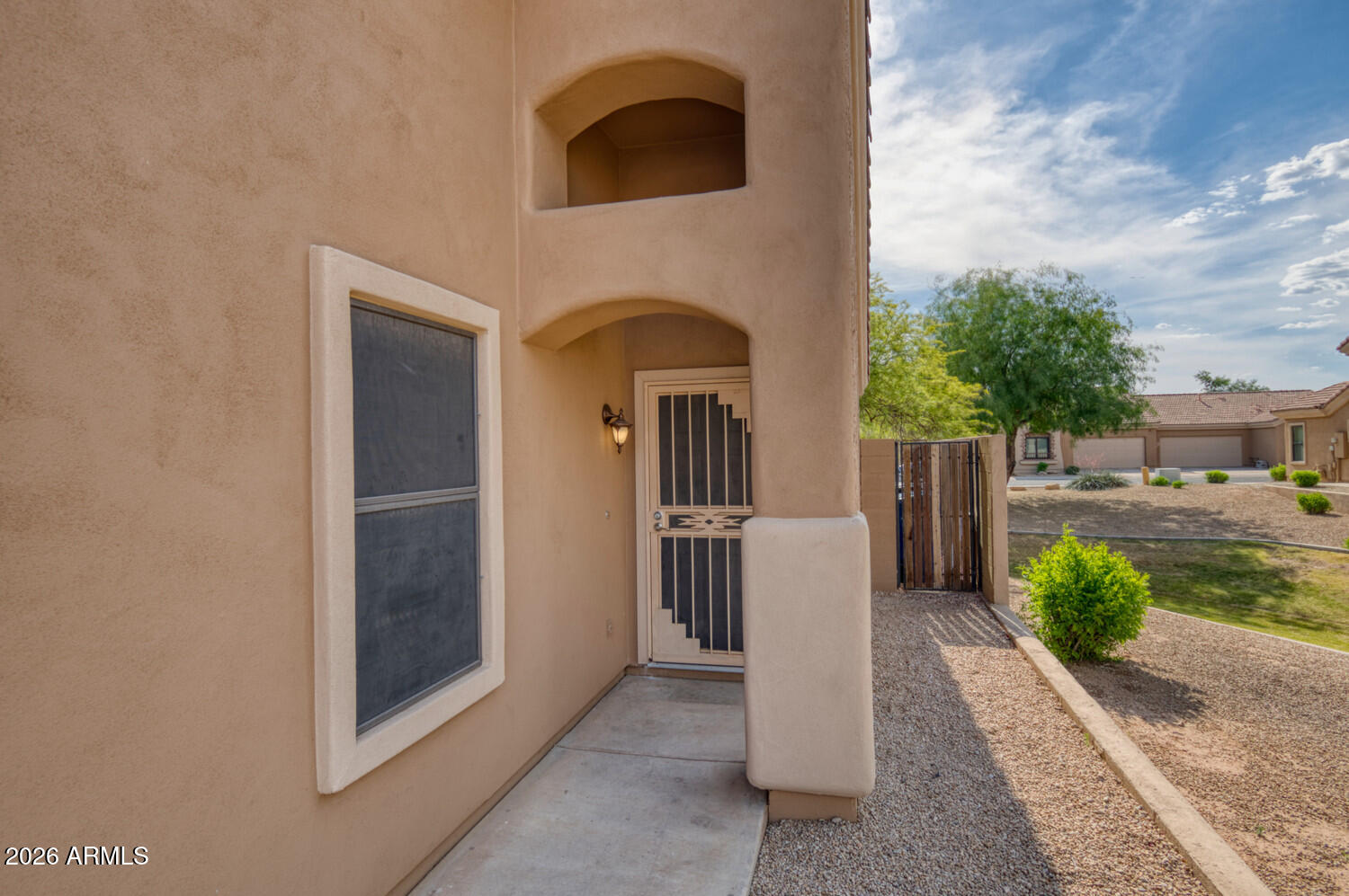 2565 South Signal Butte Road, Unit 46 Mesa, AZ 85209 - Photo 5 of 41 a front view of a house with a yard