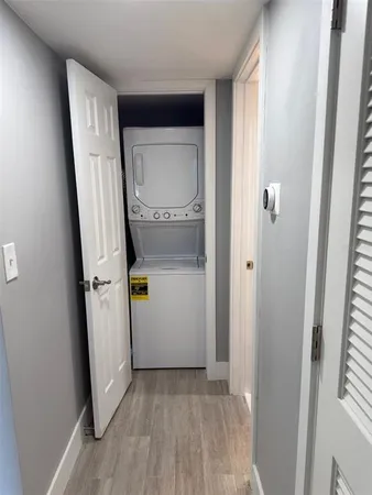 a view of storage and utility room with closet