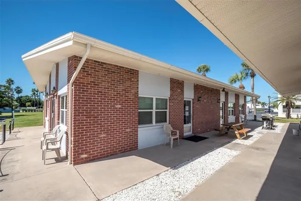 a front view of a house with a patio