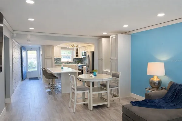 a view of a dining room with furniture window and wooden floor