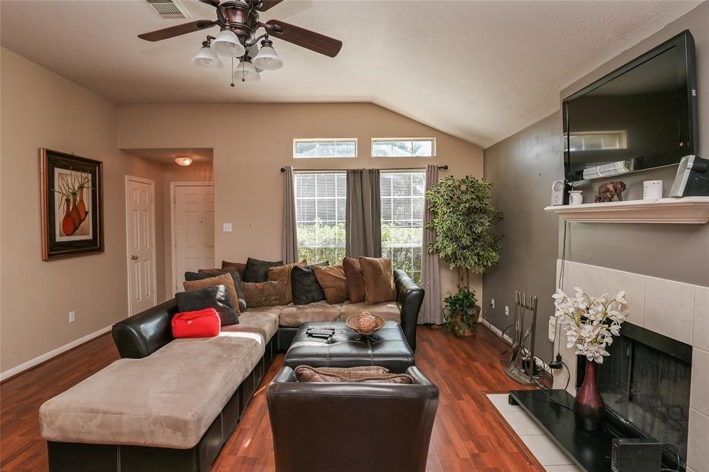 18446 South Wimbledon Drive Katy, TX 77449 - Photo 5 of 24 a living room with furniture and a flat screen tv