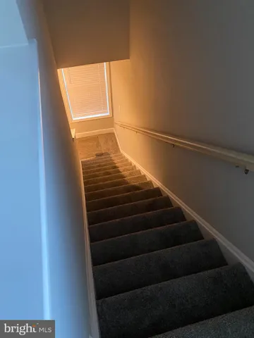 a view of an empty room with closet area