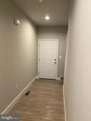 a view of a room with racks on the wall