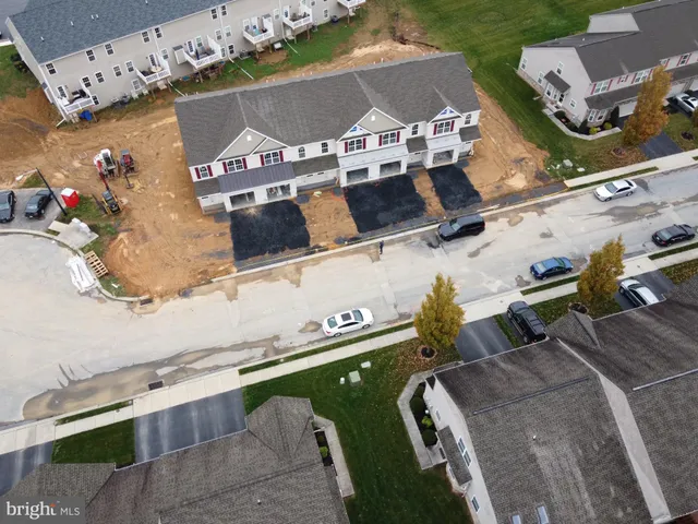 an aerial view of a house with a swimming pool