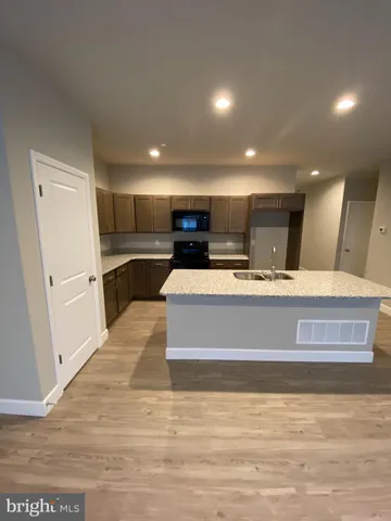 a view of a kitchen with a sink and dishwasher
