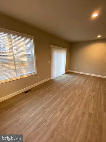 a kitchen with stainless steel appliances granite countertop a sink and a microwave