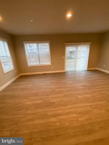 an aerial view of a house with outdoor space