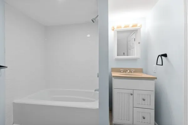 a bathroom with a sink a vanity and mirror