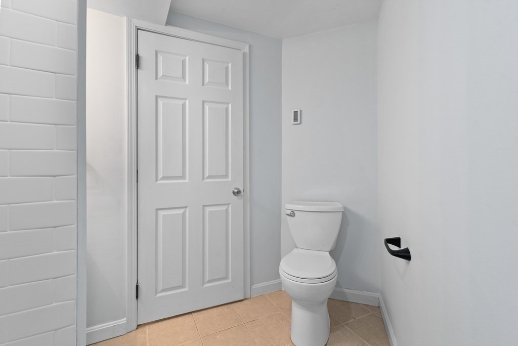 2 Woodbine Street, Unit 1 Boston, MA 02119 - Photo 12 of 20 a bathroom with a toilet