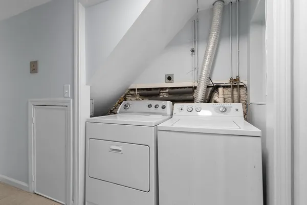 a utility room with dryer and washer