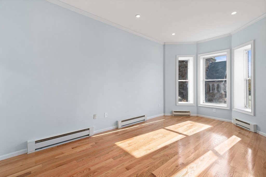 2 Woodbine Street, Unit 1 Boston, MA 02119 - Photo 8 of 20 a view of an empty room with a window