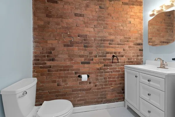 a bathroom with a toilet and a sink